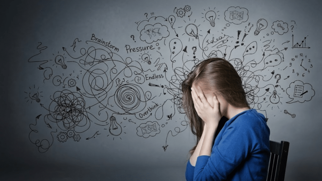 woman covering her face surrounded by chaotic doodles representing a thought disorder and overwhelming anxiety