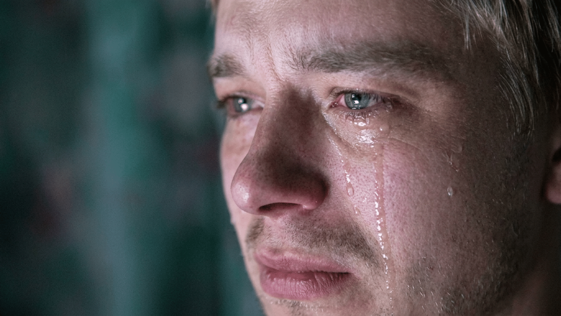 individual staring out a window feeling emotionally numb and searching for answers about why they cant cry