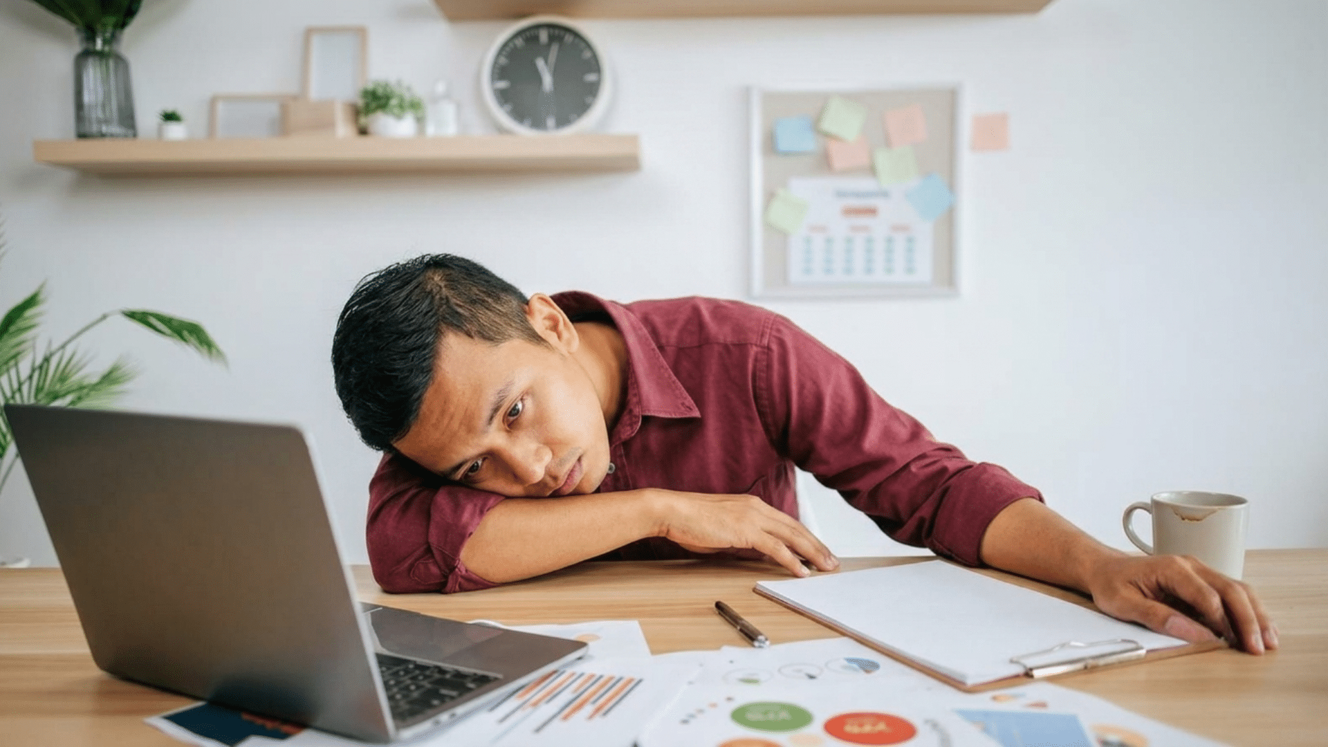 person sitting alone looking exhausted and unmotivated while struggling to begin everyday tasks at home