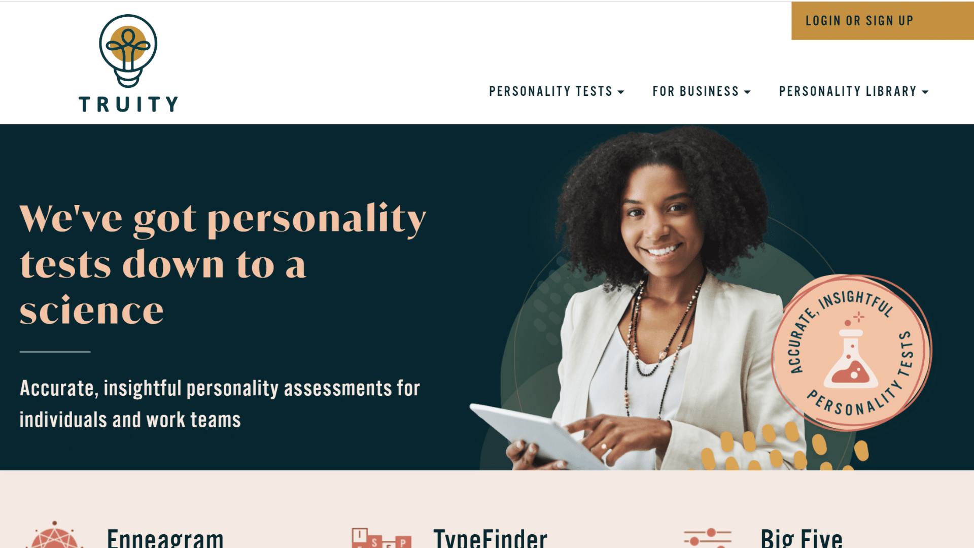 truity website homepage with a smiling woman holding a tablet and text about personality tests down to a science